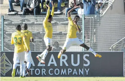  ?? / LEFTY SHIVAMBU / GALLO IMAGES ?? Sundowns’ Themba Zwane, right, celebrates his goal with Percy Tau, Hlompho Kekana and Khama Billiat against SuperSport on Saturday. Downs won 2-0.