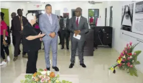  ?? (Photo: Gregory bennett) ?? Sister Susan Frazer (left) engages Prime Minister Andrew Holness (centre) in a conversati­on inside the St John Bosco Vocational Training Centre. Looking on is Manchester’s Custos Garfield Green.