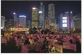  ?? (AP/Vincent Yu) ?? People watch a movie in an outdoor park in Hong Kong last week.