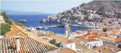  ?? RICK STEVES ?? A traffic jam in the port town of Hydra usually involves three donkeys and a fisherman. Slow and steady could be the lifestyle motto for this lazy and lovely Greek community.