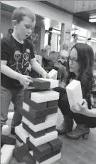  ?? Photo submitted by Lethbridge Early Years Coalition ?? Finn, and his mother Serina, engage in childled play together during L-SKIP (Lethbridge Seniors and Kids Intergener­ational Program) at Alberta Rose Lodge.