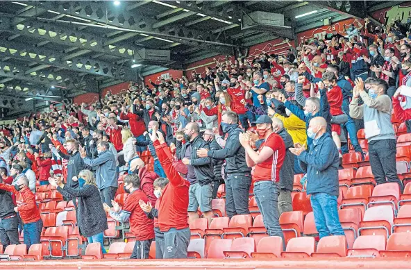  ?? Picture by Wullie Marr. ?? OH WHAT A NIGHT: Aberdeen supporters celebratin­g the opening goal in the Dons’ 5-1 victory over BK Hacken at Pittodrie.