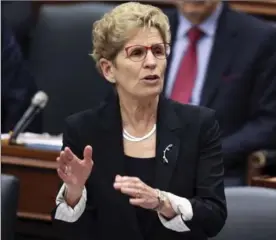  ?? ANDREW FRANCIS WALLACE, TORONTO STAR ?? "It’s (our) commonalit­ies that make it possible for us to create this country, to create this province, and that’s why it enrages me — it enrages me that we still have to have this conversati­on globally,” Ontario Premier Kathleen Wynne said