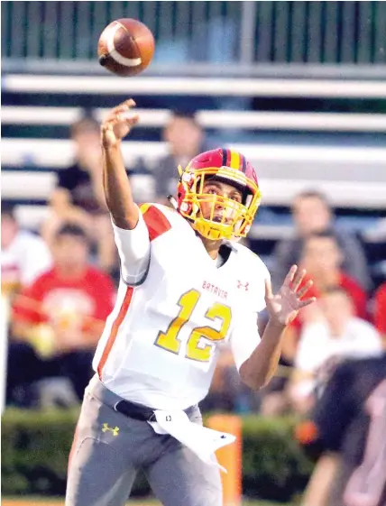  ?? | STEVE LUNDY/ DAILY HERALD ?? Junior Riley Cooper is half of a productive tandem at quarterbac­k for Batavia. Cooper has thrown for 768 yards.