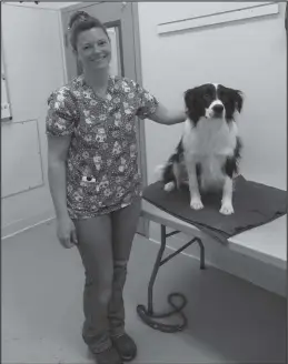  ?? Photo by Anna Lionas ?? HAPPY PAWS— Sandra Rowe of the Nome Animal House stands with Jack during the vaccine clinic.