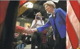  ?? CHARLES KRUPA Associated Press ?? ELIZABETH WARREN told a New Hampshire crowd last week that the nation has “a government that’s been captured by the rich and the powerful.”