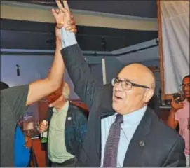  ?? TRENTONIAN FILE PHOTO - KYLE FRANKO ?? The city of Trenton’s mayor-elect Reed Gusciora has his hand raised by a supporter after he entered South Rio in Trenton following his victory over Paul Perez in the mayoral runoff election.