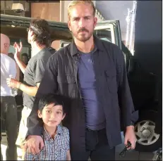  ?? COURTESY PHOTO ABBIE SOLAREZ ?? Jason Solarez, 7, of brawley, stands with actor Jim Caviezel on the set of “Sound of Freedom,” which filmed over the weekend in Calexico at the old downtown port of entry, among other locations.