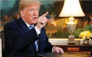  ?? Reuters/Jonathan Ernst/File ?? SPELLING OUT: Caption US President Donald Trump speaks to reporters after signing a proclamati­on declaring his intention to withdraw from the JCPOA Iran nuclear agreement in the Diplomatic Room at the White House in Washington, US May 8, 2018. -