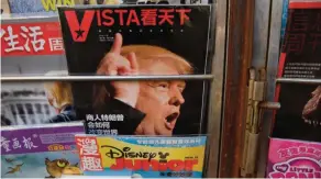  ??  ?? BEIJING: A magazine featuring a cover story about US President-elect Donald Trump is seen at a news stand in Beijing yesterday. — AFP