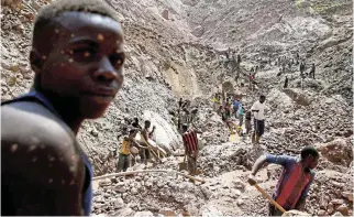  ?? /Reuters/File ?? Open-shaft mining: Miners work at an open shaft of the SMB coltan mine near the town of Rubaya in the Eastern Democratic Republic of Congo.