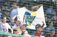  ?? GENE J. PUSKAR/AP ?? Elizabeth, New Jersey, Little League fans hold a banner during a game at the Little League World Series in South Williamspo­rt.