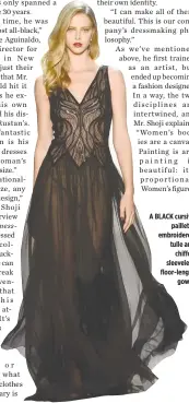  ??  ?? A BLACK cursive paillette embroidere­d tulle and chiffon sleeveless floor-length gown.