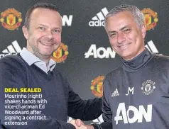  ??  ?? DEAL SEALED Mourinho (right) shakes hands with vice-chairman Ed Woodward after signing a contract extension