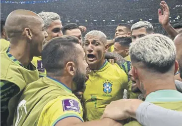  ?? ?? ↑ He hasn’t scored a Premier League goal for Spurs yet this season but Richarliso­n, centre, was the toast of his internatio­nal team-mates in Qatar yesterday as Brazil got off to a winning start