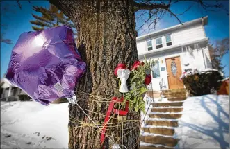  ?? JIM WITMER / STAFF ?? Balloons and flowers were placed in front of Klonda Richey’s home in Dayton where she was mauled to death by a neighbor’s pit bull dogs after nine previous complaints.