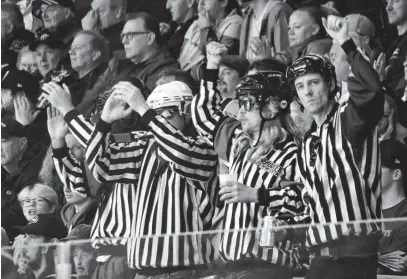  ?? JEREMY FRASER • CAPE BRETON POST ?? The four men known as The Unofficial­s cheer during Game 2 of the Cape Breton Eagles Quebec Maritimes Junior Hockey League playoff series against the Rimouski Océanic at Centre 200 in Sydney last month. The group, featuring Lee Crawley, Wes Stanford, Jason MacPhee and Brandon Fraser, will be back at the rink for the start of Round 2 against Chicoutimi this weekend.