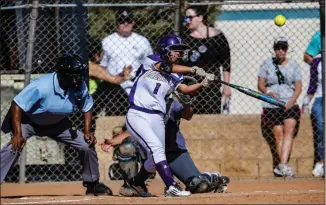  ?? Cory Rubin/The Signal (See additional photos on signalscv.com) ?? (Top) Valencia softball’s Emma Bramson grounds one up the middle in a 1-0 victory over Golden Valley. (Bottom) Senior outfielder Kelia Paragas. Paragas was 1-for-3 on the afternoon.