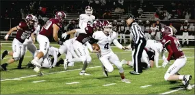  ?? Enterprise-Leader/MARK HUMPHREY ?? Gentry senior quarterbac­k Brandon Atwood runs through the Lincoln defense for a 34-yard gain during Friday’s 34-13 win by Pioneers at Wolfpack Stadium.