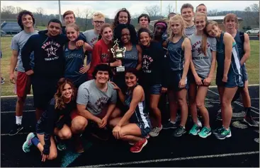  ??  ?? The Heritage High School track team celebrates after capturing the Catoosa Cup this past Thursday night. (Contribute­d photo)