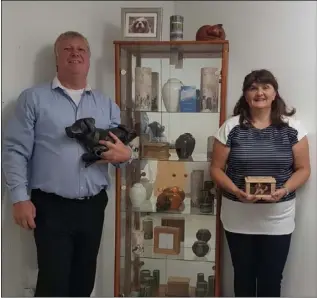  ??  ?? Anne and John Wilde with some of the urns at the pet crematoriu­m.