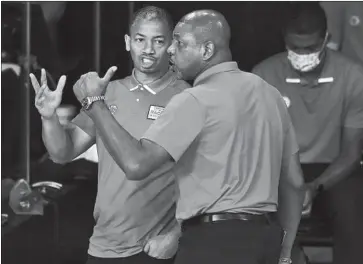  ?? Michael Reaves Getty Images ?? DOC RIVERS, right, is out as the Clippers’ coach, replaced by assistant Tyronn Lue, whom Rivers mentored. “He’s got the resume,” Clippers executive Lawrence Frank said of Lue. “He’s also got the feel.”