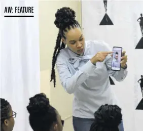  ?? ?? As video submission­s for résumé and job applicatio­ns become more common, Jamaican media personalit­y and author Amashika Lorne explains various tips about body language and posture, lighting and negative space in a frame during the workshop session.