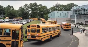  ?? John Moore / Getty Images ?? Rippowam and Cloonan middle schoolers allegedly created the videos as part of a virtual “battle” between the schools that included images of students using their hands to imitate the firing of a gun, police said.