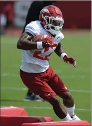  ?? (NWA Democrat-Gazette/Andy Shupe) ?? Arkansas junior running back Trelon Smith, shown during a practice earlier this month, was part of a large group of players in no-contact jerseys during Thursday’s practice.