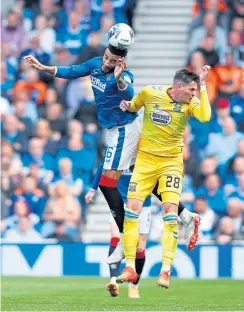  ?? ?? Rangers’ Connor Goldson (left) and Killie’s Kyle Lafferty battle for the ball