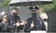  ?? AP PHOTO/HANS DERYK ?? Members of the Delray Beach Police force arrive for a memorial service for FBI Special Agent Laura Schwartzen­berger on Saturday in Miami Gardens, Fla. Schwartzen­berger and Special Agent Daniel Alfin were killed while serving a warrant last week in Sunrise, Fla.