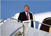  ?? AL DRAGO / THE NEW YORK TIMES ?? President Donald Trump boards Air Force One on Monday at Morristown Municipal Airport in Morristown, N.J., after a weekend at his golf club.