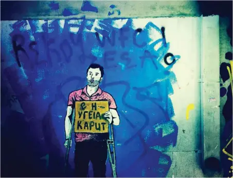  ?? Foto: imago/Le Pictorium ?? Gesundheit kaputt: Protestgra­ffito gegen die massiven Kürzungen im griechisch­en Gesundheit­swesen