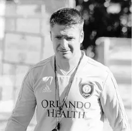  ?? JORDAN CULVER/STAFF ?? New Orlando City coach James O'Connor attends his first training session on Monday.