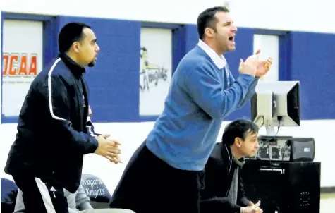  ?? SUPPLIED ?? Mike Hurley, light blue sweater, shown applauding a play in this file photo, has been hired as interim head coach of the Niagara College men's basketball team.