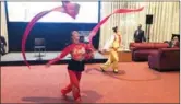  ??  ?? Dancers perform a traditiona­l Chinese ribbon dance, wowing the audience at the “Beautiful China - World Heritage Tourism Promotion Event” on Thursday in New York.