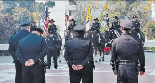  ?? Ben Botkin ?? Review-journal Capital Bureau San Francisco police officers line up Thursday outside St. Mary’s Cathedral in San Francisco after the funeral Mass for Stacee Etcheber. Etcheber was one of the 58 victims of the Route 91 Harvest festival mass shooting on...