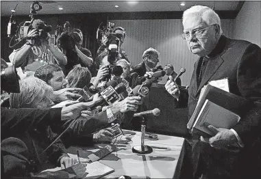  ?? [THE ASSOCIATED PRESS FILE PHOTO] ?? Cardinal Bernard Law, used to rubbing elbows with presidents and prelates, found himself in the media spotlight in 2002 thanks to Boston Globe stories that uncovered the Boston diocese’s cover-up of sex abuse by its priests. Law resigned that year as archbishop.