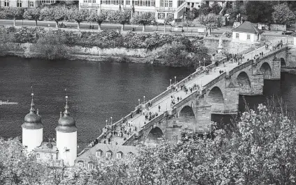  ?? ?? The terrace at the restaurant in the Molkenkur, a hotel on a hill above Old Town, the center of Heidelberg, offers a spectacula­r view of the Old Bridge, or Alte Bruecke.