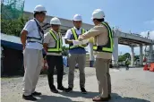  ?? DPWH ?? THE Department of Public Works and Highways (DPWH) and private concession­aire Cavitex Infrastruc­ture Corp. (CIC) inspect the C5 South Link constructi­on on Wednesday, led by DPWH Secretary Mark A. Villar (third from right) and CIC President and CEO Luigi L. Bautista (rightmost).