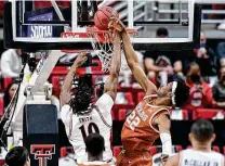  ?? Justin Rex / Associated Press ?? Texas Tech created several easy scoring chances in the second half, including this lay-in by Tyreek Smith over UT’s Kai Jones.