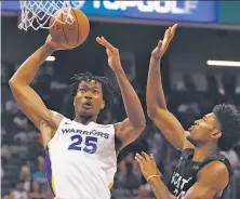  ?? Rich Pedroncell­i / Associated Press ?? Damian Jones (25) is not as polished a center as Omari Spellman, who comes to the Warriors from the Hawks.