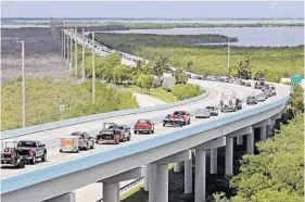  ?? ALAN DIAZ/AP ?? Motorists head north on U.S. 1 past Key Largo on Wednesday after Keys officials announced mandatory evacuation­s.