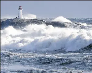 ?? CP PHOTO ?? Waves pound the shore at Peggy’s Cove, N.S., on Jan. 5. If it seems like the weather’s getting weirder, you’re not wrong. An index of extreme weather in Canada compiled by the insurance industry backs you up.