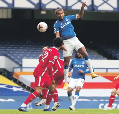  ?? EPA ?? Dominic Calvert-Lewin heads home for Everton as yesterday’s Merseyside derby against Liverpool ended in a 2-2 draw