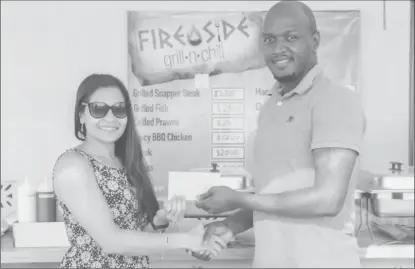  ??  ?? FireSide Grill and Chill yesterday provided corporate support for the GRFU 7s Rugby tournament scheduled for tomorrow at the National Park. In the photo above Ms Deodat of FireSide presents the cheque to GRFU Vice President Rawle Toney