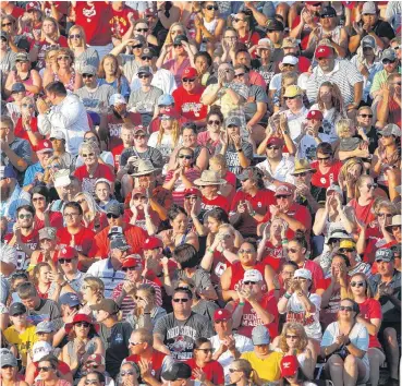  ?? [PHOTO BY SARAH PHIPPS, THE OKLAHOMAN] ?? OU fans cheer on Tuesday during Game 2 as the Sooners beat the Florida Gators, 5-4, at ASA Hall of Fame Stadium in Oklahoma City.