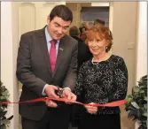  ??  ?? Minister of State Brendan Griffin cutting the tape on the new KETB centre in the Rice House on Main Street, with centre manager Eithne Boland.