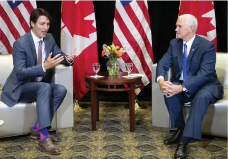  ?? RYAN REMIORZ/THE CANADIAN PRESS ?? Prime Minister Justin Trudeau meets with U.S. Vice-President Mike Pence at the National Governor’s Associatio­n Special Session in Providence, R.I.