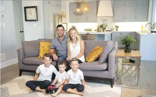  ?? PHOTOS: MIKE HENSEN ?? Dave and Christa Rosser with children, Nolan, 8, Aidan, 2, and Drew, 5 are happy in their home designed with the expert help of Rebecca Courey.